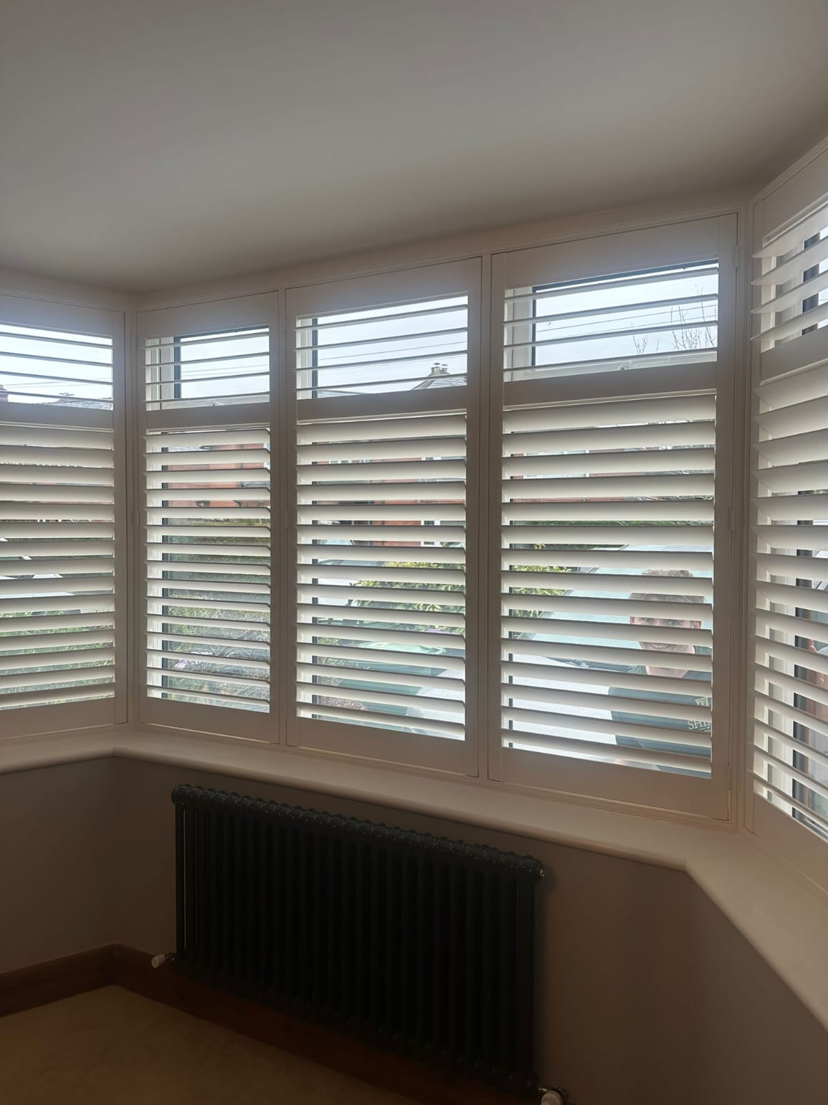 Shires Shutters installation, real shutter corner bay radiator