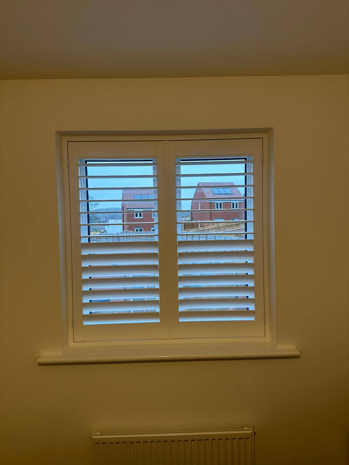 Shires Shutters installation, shutter bedroom cream
