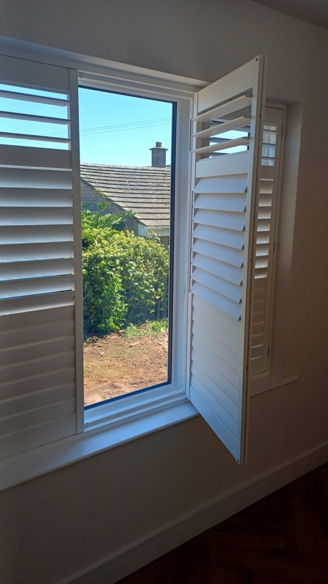 Shires Shutters installation, shutter white open panel garden