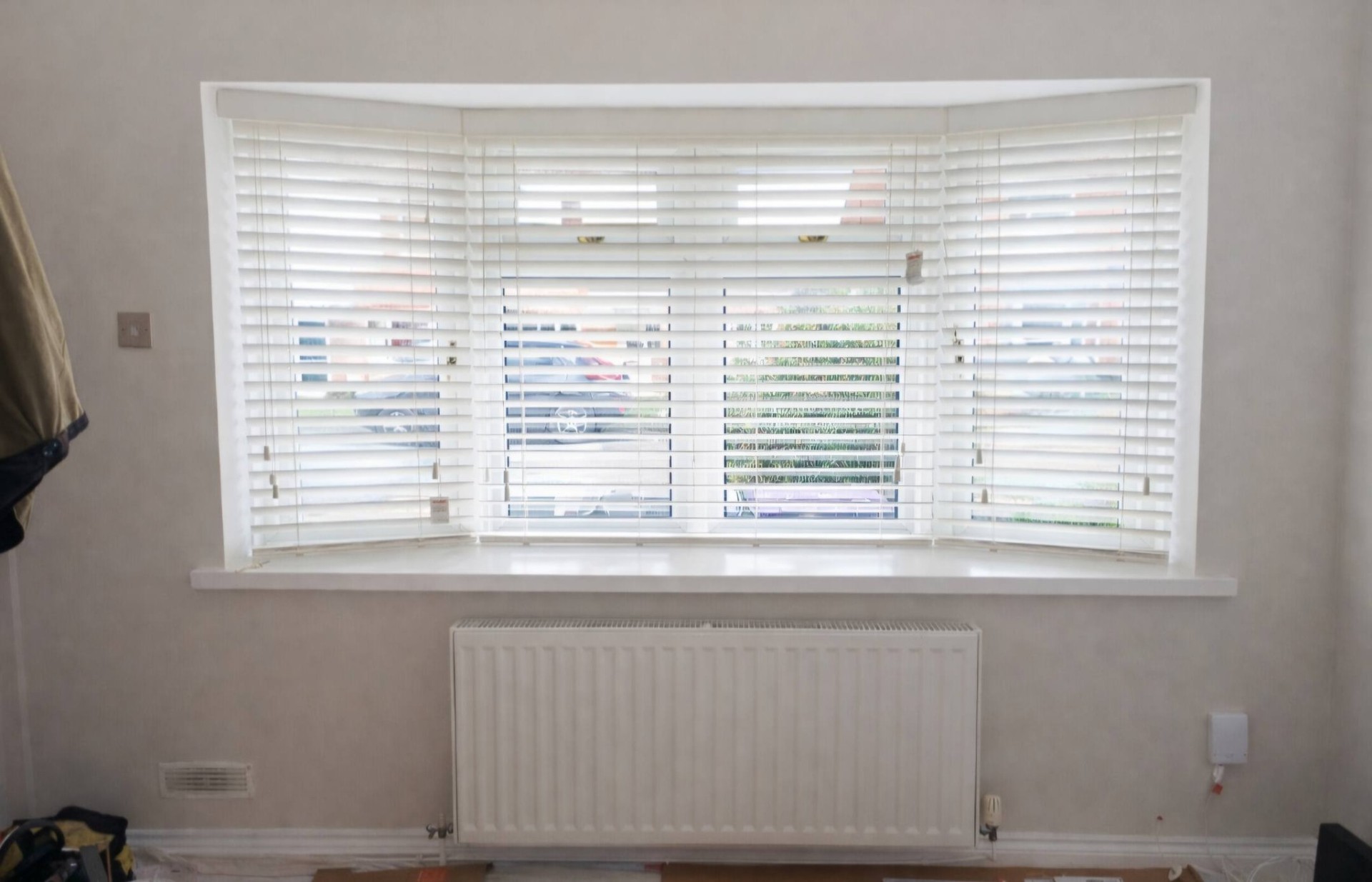 Real-wood Venetian blinds installed in a traditional bay window by Shires Shutters